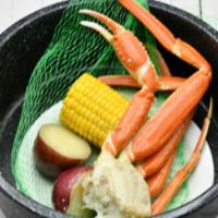Kid's Snow Crab · A cluster of snow crab, corn on the cob, and potatoes.