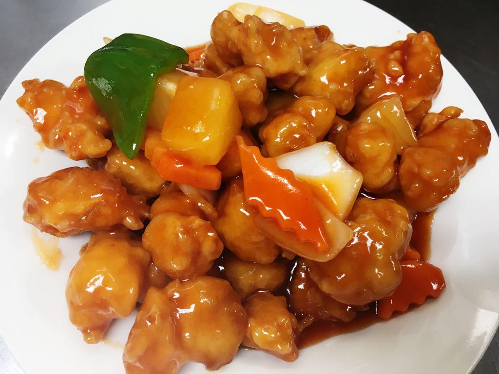 Honolulu Chicken · Crispy chicken with house veggies and pineapple sauteed in sweet and sour sauce. Served with white rice.
