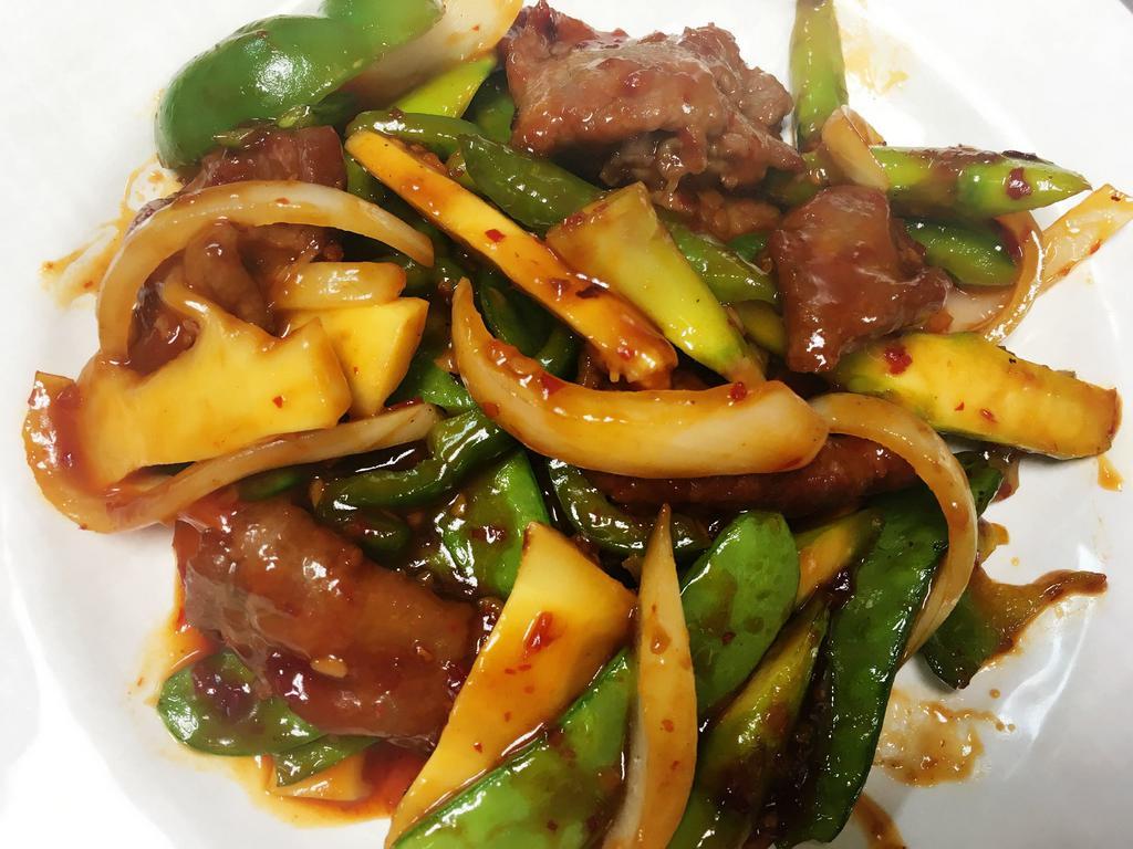 Basil Beef · Slices of beef sauteed with onion, peppers, and snow pea in basil sauce. Hot and spicy.
