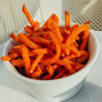 Sweet Potato Fries · Curried ketchup. Gluten free available upon request. Vegan.