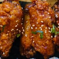 Aloha Wings · Garnished with sesame seeds and green onions