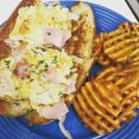 Western Omelet Sub · Ham & Onion Omelet on a sub roll, a classic! Cheese available upon request. (Shown with waff...