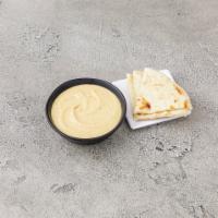 Hummus · Chickpeas and garlic. Served with warm pita bread. 