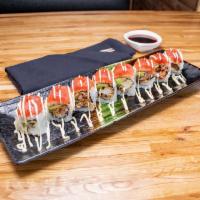 R19. D.C. Roll · Fried soft shell crab and avocado inside, topped with spicy tuna, Japanese mayo and Sriacha....