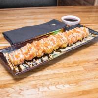 R20. Green Monster Roll · Spicy tuna, salmon and avocado wrapped in green soy paper and deep fried, topped with spicy ...