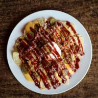 BBQ Nachos · Choice of pork BBQ, smoked chicken, or beef brisket. Topped with nacho cheese, jalapenos, so...