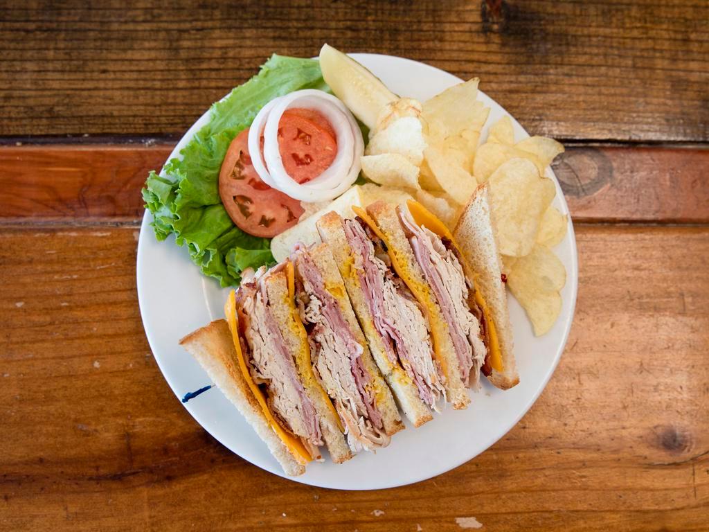 Classic Club Sandwich Combo · Sandwich combo includes lettuce, tomatoes, onions, pickle spear, chips & drink.