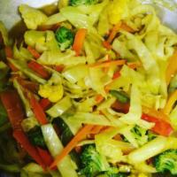 Island Stir Fry · Cabbage, broccoli, carrot, red and green peppers and jerk chicken.  S