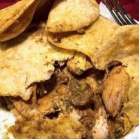 Curry Chicken Roti · A simple Caribbean dish that explodes with flavor, this dish features our Curry Chicken serv...