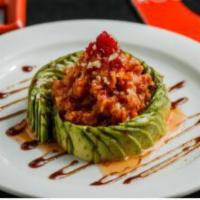 Twisted Tuna · Finely chopped spicy red tuna, wrapped with sliced avocado and topped with tobiko, sweet chi...