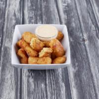 Mac-N-Cheese Bites · Six cheese mac-n-cheese deep fried served with our own habanero ranch sauce.