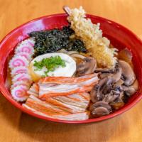 Nabeyaki Udon · Hot pot style vegetable udon noodle soup topped with chicken, tempura shrimp, egg, crab stic...