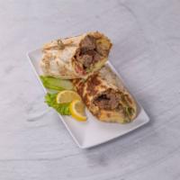 Lamb Shawarma · Donar lamb, veggies, tzatziki sauce and garlic sauce wrapped in shawarma bread.