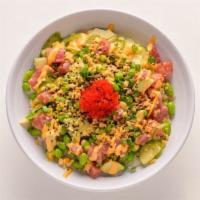 Spicy Tuna · Ahi tuna, edamame, cucumber, jalapeno, crispy onion, tobiko, sriracha aioli, and sweet shoyu.