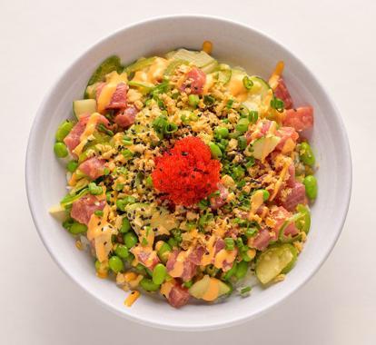 Spicy Tuna · Ahi tuna, edamame, cucumber, jalapeno, crispy onion, tobiko, sriracha aioli, and sweet shoyu.