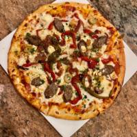 Oregano-Fennel Lamb Sausage Pizza · Tomato, feta, peppers, red onions, mozzarella and olives.