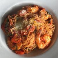Spanish Shrimp Pasta · Garlic jumbo shrimp, angel hair, basil, cherry tomato, Parmesan, and extra-virgin olive oil.