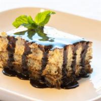 Tiramisu Cake · Creamy expresso-soaked cake with chocolate syrup