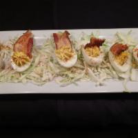 Deviled Eggs And Bacon · Our special deviled eggs topped with applewood smoked bacon. (GF)
