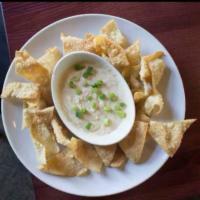Inside Out Crab Rangoon Dip · Fried wantons, sweet and sour sauce, and a crab rangoon cheese dip.