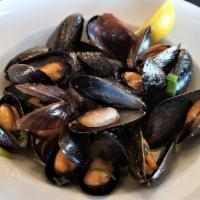 PEI Black Mussels · Prince Edward Island mussels sauteed in a wine wine butter sauce. (GF)