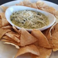Spinach And Artichoke Dip · Fried chips with a special house made spinach and artichoke dip.