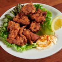 Karaage. · Seasoned deep fried chicken with mayo on the side.