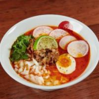 Carnitas Ramen. · Spicy tonkotsu chicken and pork broth, egg noodles, housemade carnitas, ½ ramen egg, radish,...