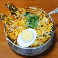 Chicken Biryani · Basmati rice cooked in Andhra style flavored chicken.
