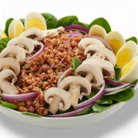 Spinach Salad (Family (Serves 4-6)) · Tender baby spinach greens topped with crumbled bacon, red onion, fresh mushrooms and hard-b...