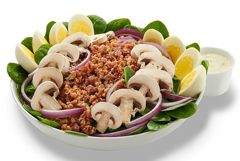 Spinach Salad (Family (Serves 4-6)) · Tender baby spinach greens topped with crumbled bacon, red onion, fresh mushrooms and hard-boiled eggs.