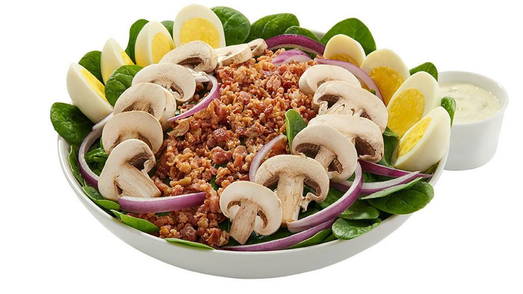 Spinach Salad (Indiviudal) · Tender baby spinach greens topped with crumbled bacon, red onion, fresh mushrooms and hard-boiled eggs.