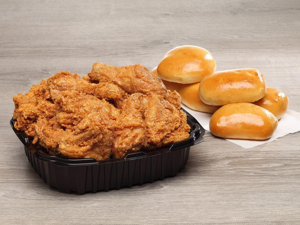 12 Piece Family Box · 12 pieces of white and dark meat paired with your choice six fluffy yeast rolls OR six flaky biscuits.