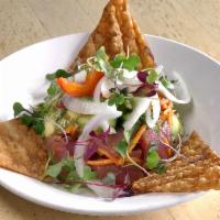 Ahi Poke · Diced ahi tuna, avocado, cucumber, cilantro, carrots, with ginger dressing.  Topped with cur...