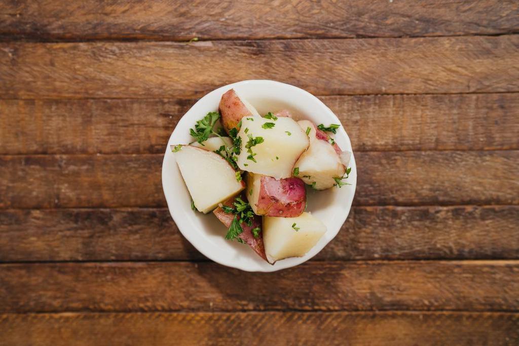 Parsley Potatoes · Steamed Idaho potatoes simply seasoned and garnished with fresh parsley.