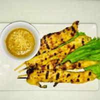 A4. Chicken Satay · Charbroiled chicken skewers served with a creamy Thai peanut sauce.