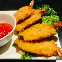 A5. Tom Chien Dua · Coconut prawns. Breaded coconut prawns deep fried and served with house sweet chili sauce.