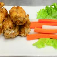 A6. Caramelized Chicken Wings · Deep fried wings tossed in fried garlic and caramelized fish sauce.