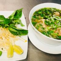 P3. Pho Ga · Pho with chicken. Includes broth, flat rice noodles, garnished with mixed onions, cilantro a...