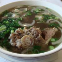 P6. Pho Duoi Bo/OX TAIL PHO  · Oxtail pho. Includes broth, flat rice noodles, garnished with mixed onions, cilantro and ser...