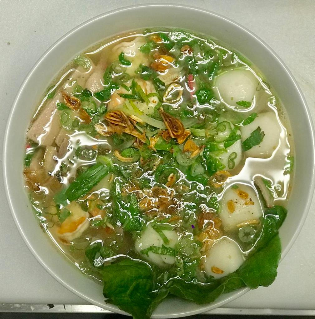 F5. Wonton Soup · House-made wonton soup with egg noodle and BBQ pork, bok choy topped with roasted shallots.