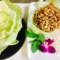 S2. Ga Cuon Salad · Chicken lettuce wrap. Chicken wok seared with water chestnuts, mushroom, mint served with le...