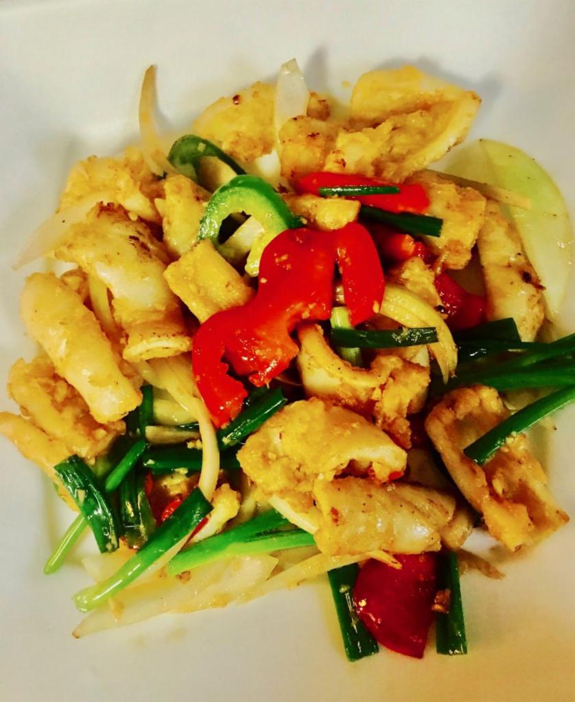 X9. Muc Rang Muoi · Salt and pepper squid. Lightly breaded salt and pepper squid wok seared with onions, red bell peppers and jalapenos served with white rice.