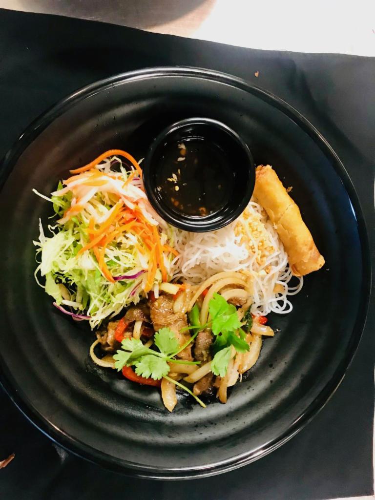 B4. Bun Bo Xao Bowl · Sauteed beef. Wok seared beef slices with bell peppers and onions. Includes vermicelli rice noodles, diced iceberg green leaf lettuce, cabbage, bean sprout, cucumber, pickled julienned carrot and daikon radish, topped with crushed peanuts and scallion.