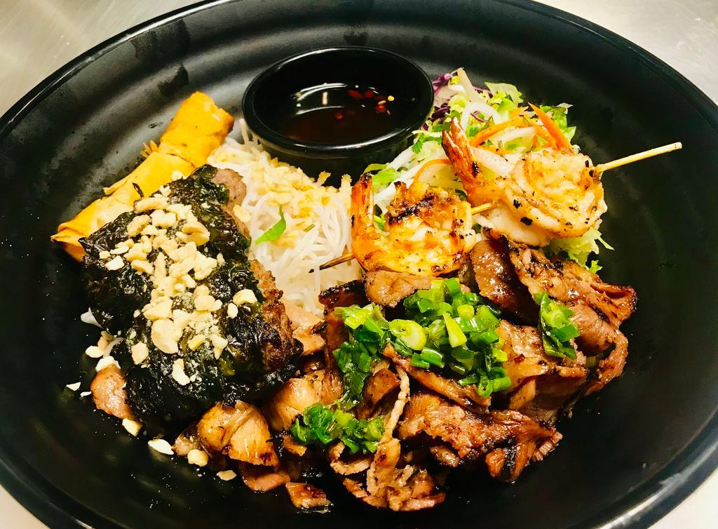 B11. Bun Dac Biet Bowl · Combination. Grilled pork, chicken and shrimp, egg roll and la lot beef. Includes vermicelli rice noodles, diced iceberg green leaf lettuce, cabbage, bean sprout, cucumber, pickled julienned carrot and daikon radish, topped with crushed peanuts and scallion.