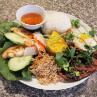 R5. Suon Bi Cha Plate · Grilled pork chop, egg custard and pork skin. Includes lettuce, tomato, cucumber slices, pic...