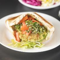 Classic Falafel PIta GRILLED  - NOT FRIED · Grilled Falafel Balls- Made from scratch. In a fresh baked pita with Hummus, Tabouli, Lettuc...