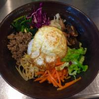 1. Bibimbob (Vegetables & Bulgogi) · Steamed rice served with vegetables and Bulgogi in the bowl.
