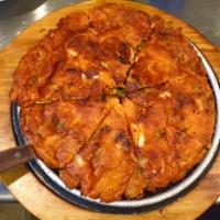 1. Kimchi Jeon · Kimchi, squid and onion pancake.