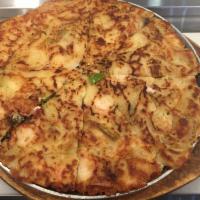 4. Gul Jeon · Oyster, seafood and green onion pancake.